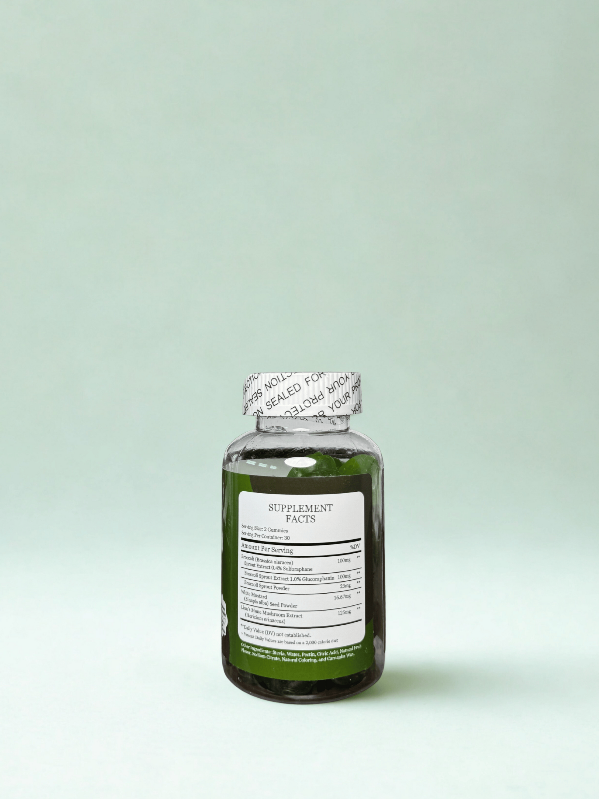 Green supplement bottle with label on a light green background